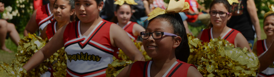 Showing some cheerleaders marching in the Children's Parade.