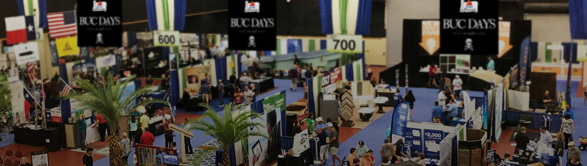 Showing vendors set up inside an arena.